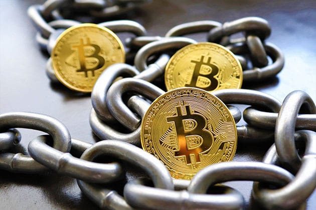 Picture of Bitcoin surrounded by chains