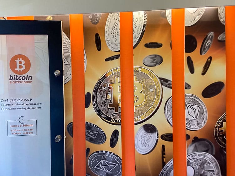 Image of orange bitcoin and crypto shop with images of bitcoins across the branding