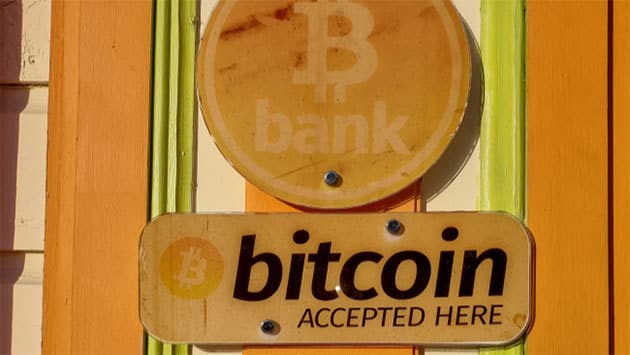 orange bank sign with bitcoin symbol on it