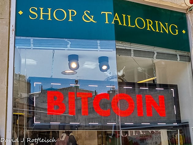 Shop & tailoring store with red bitcoin sign