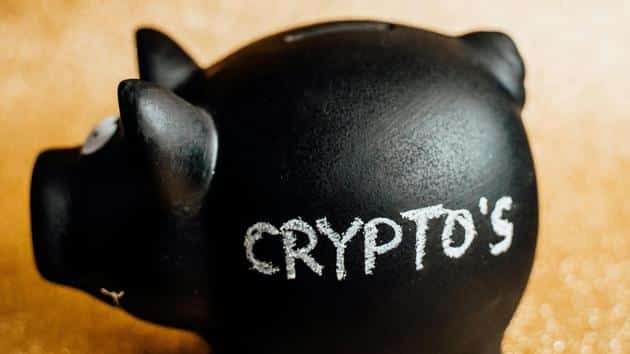 A black piggy bank that says crypto’s